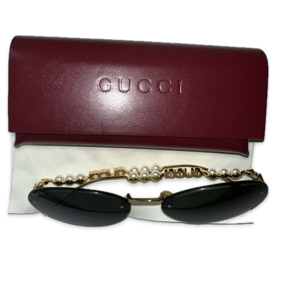 Gucci
Rimless Metal Oval Sunglasses with Faux Pearls